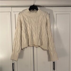Cropped Cable-Knit Turtleneck Sweater in Cream
